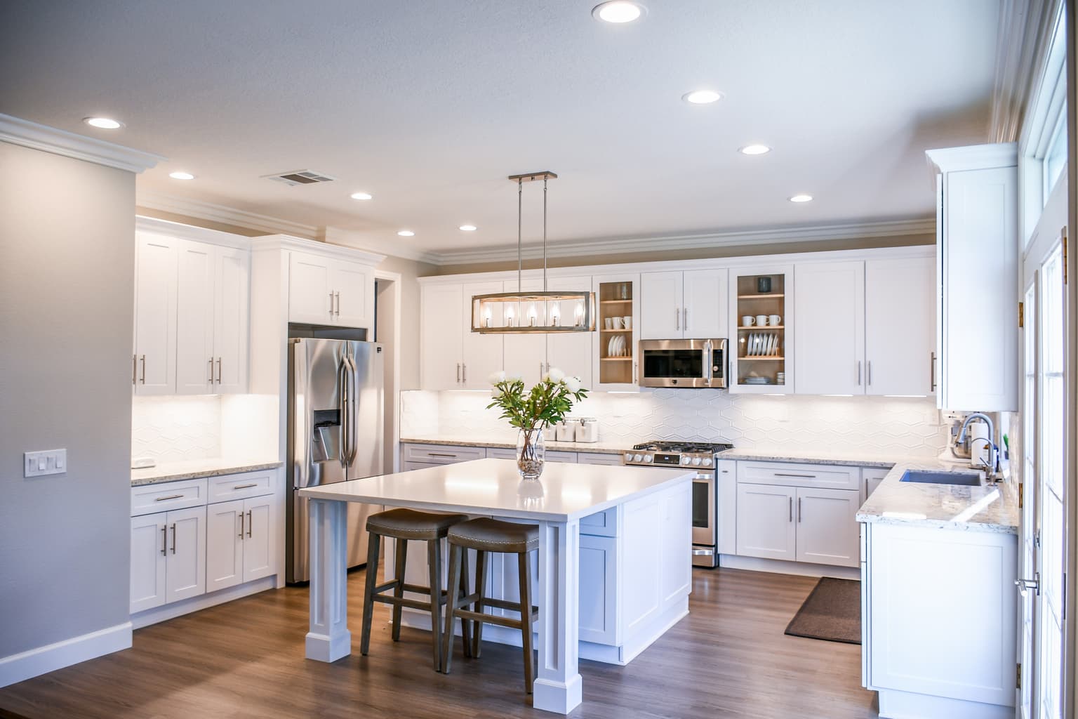 Organized kitchen with calm storage ideas and warm neutral styling