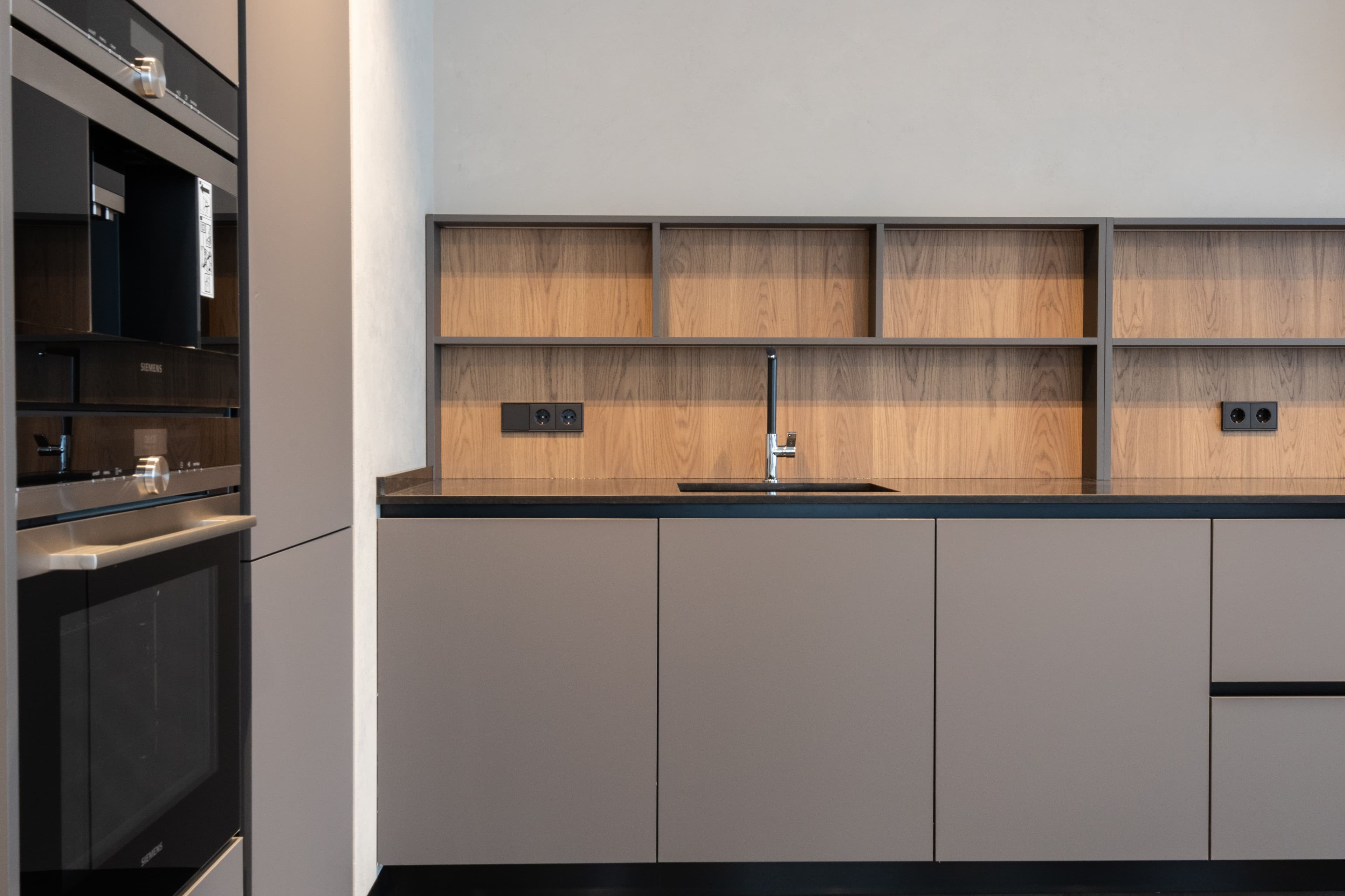 Organized neutral kitchen styled with calm storage pieces