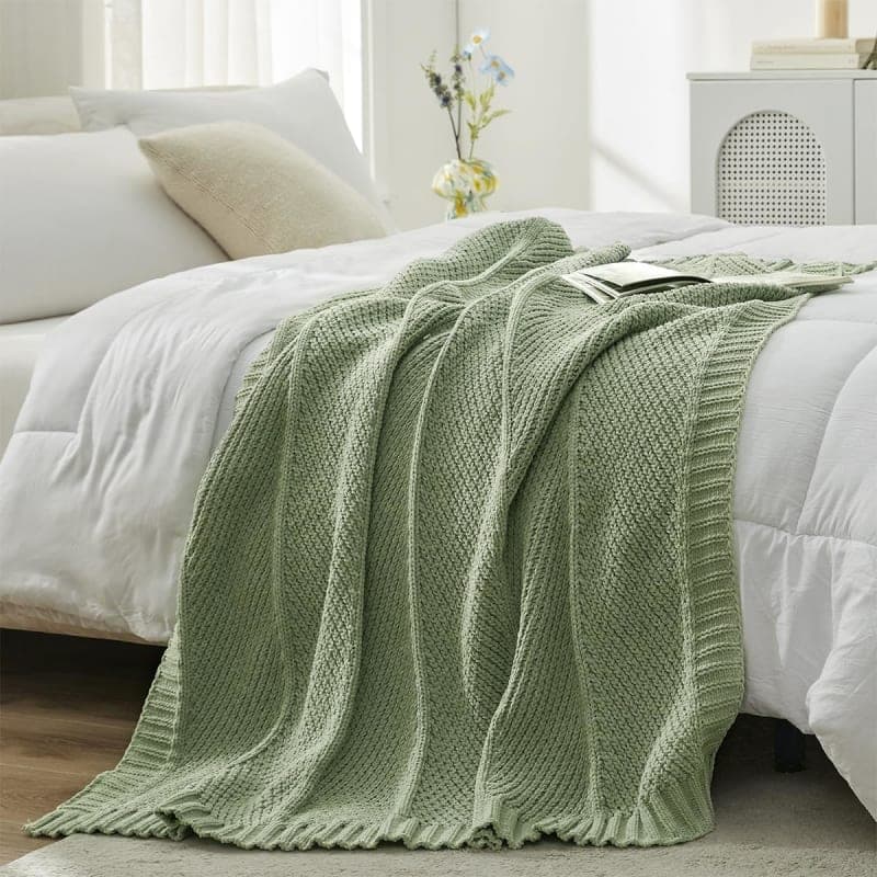 Sage green chunky knit chenille throw blanket styled on a chair for cozy living room decor gallery view 3