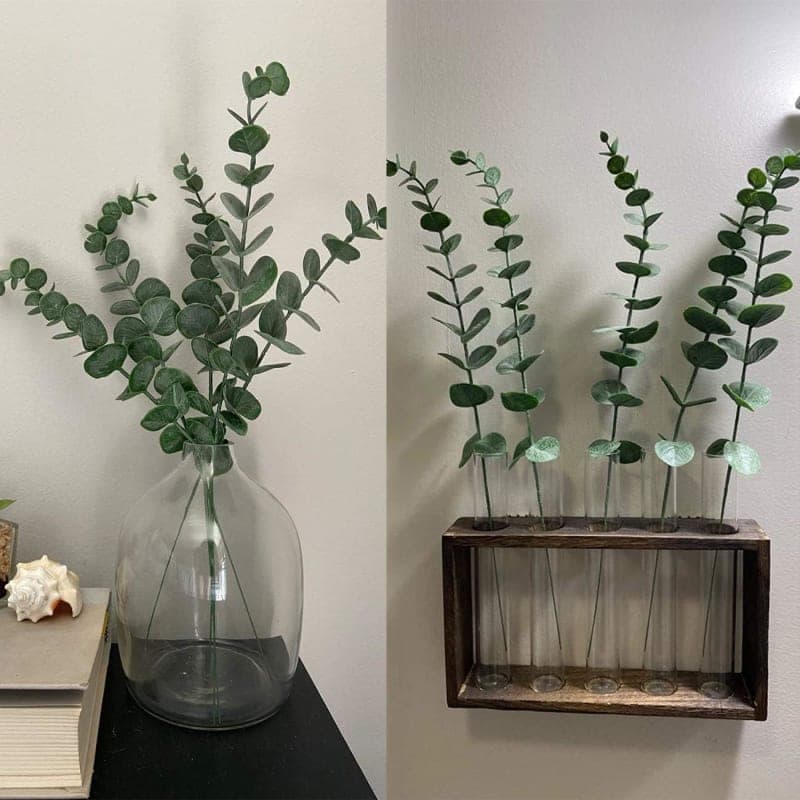 Green faux eucalyptus stems styled in a vase for dining table and home decor gallery view 1