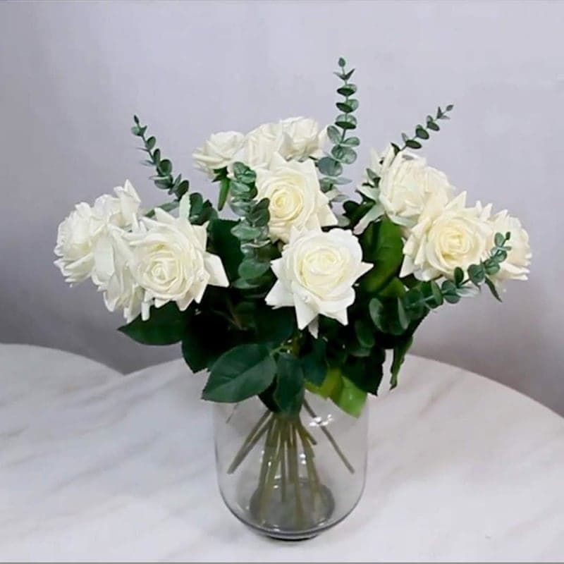 Green faux eucalyptus stems styled in a vase for dining table and home decor gallery view 3