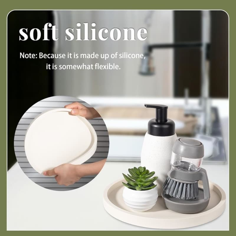 Round beige silicone organizer tray styled with a candle, diffuser, and decorative vase for a bathroom vanity or coffee table. gallery view 3