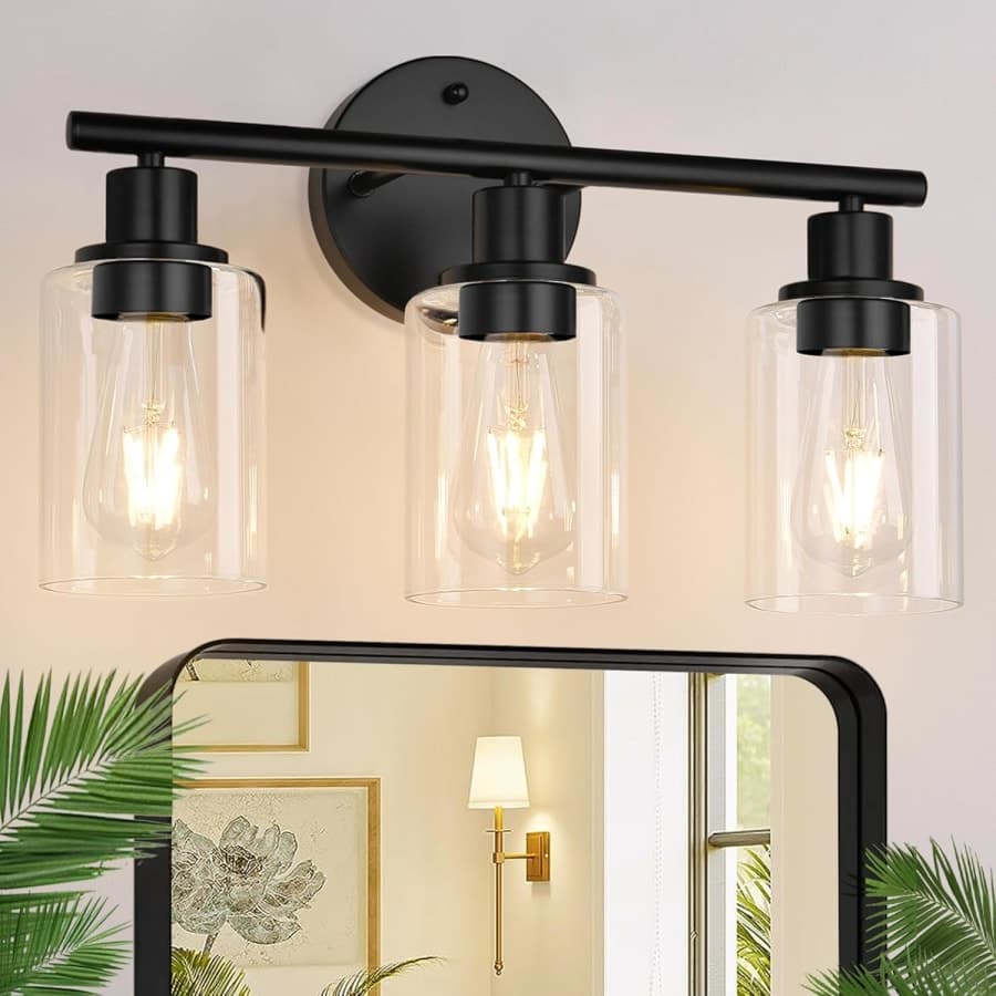 Black modern three-light vanity fixture with clear glass shades for bathroom mirror lighting