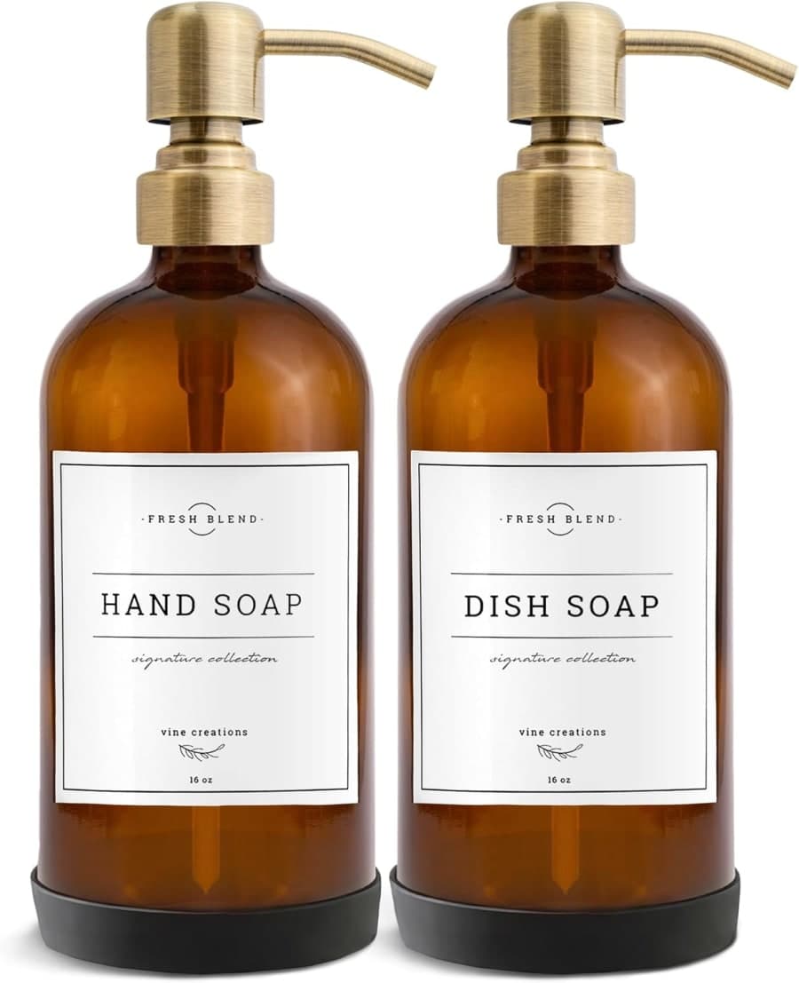 Amber glass soap dispenser set with gold pumps and labels for kitchen sink or bathroom counter styling