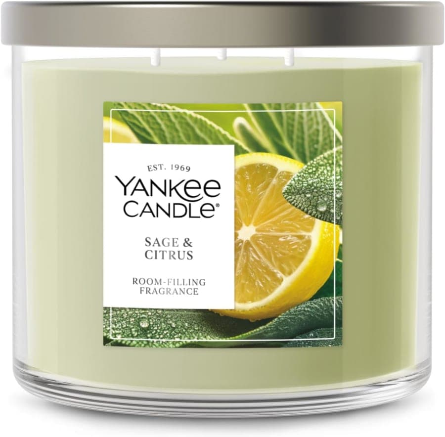 Sage and citrus scented three-wick candle in a glass jar for fresh home fragrance and cozy decor
