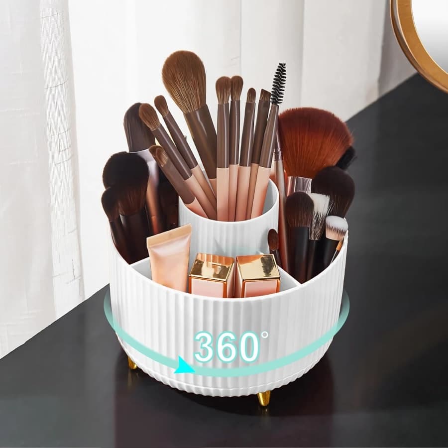 White rotating makeup brush organizer with divided compartments for bathroom vanity and desktop storage