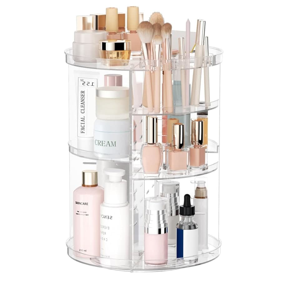 Clear rotating makeup organizer with adjustable shelves for skincare, brushes, perfume, and vanity storage