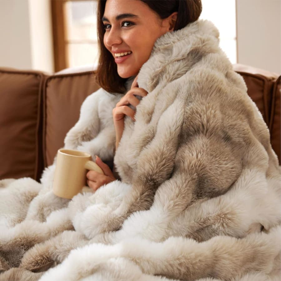 Taupe faux fur throw blanket with soft plush texture for cozy sofa, chair, or bedroom styling