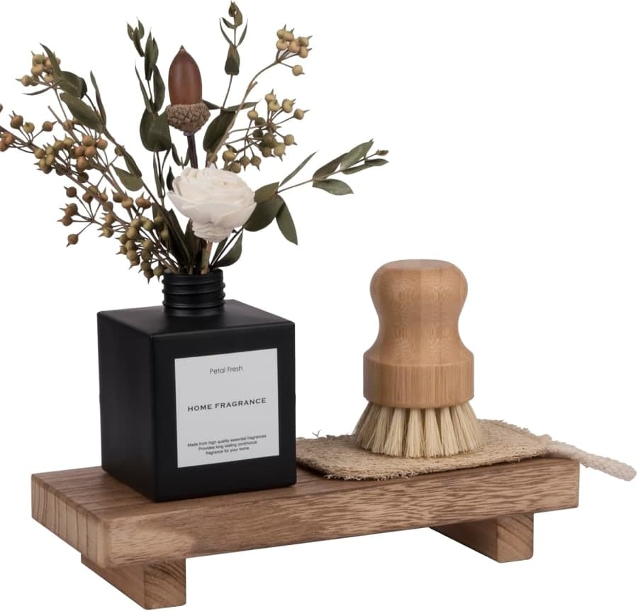 Brown wood pedestal tray stand styled with flowers, brush, and home fragrance for bathroom or kitchen decor