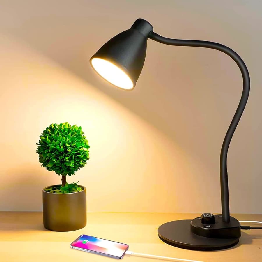 Black adjustable LED desk lamp with USB charging for bedside, study, or home office lighting