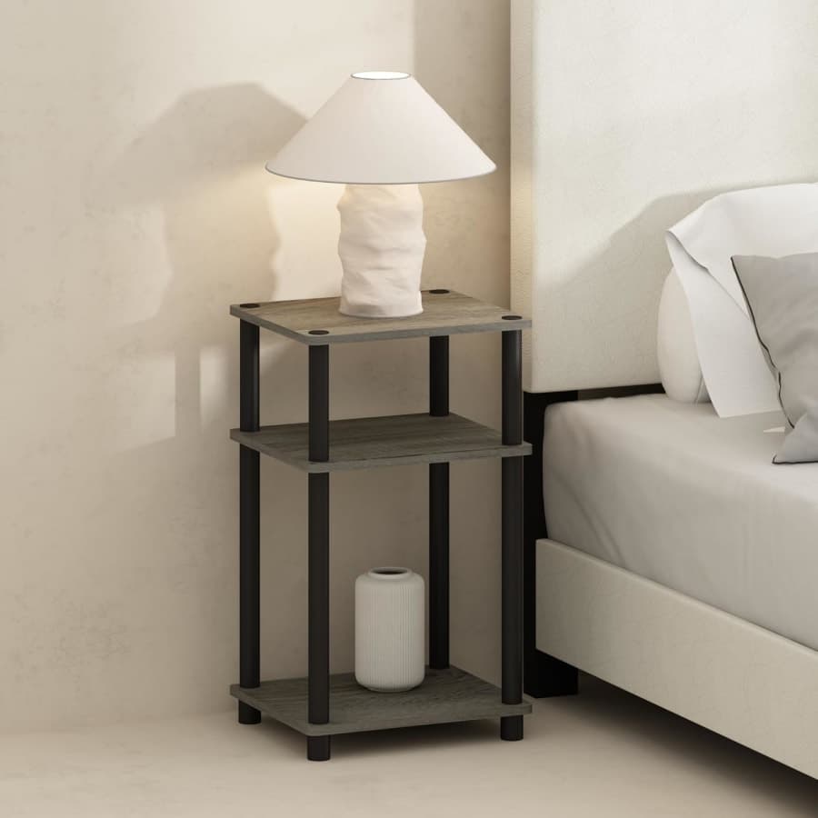Three tier French oak bedside table with black frame and open shelves for bedroom storage